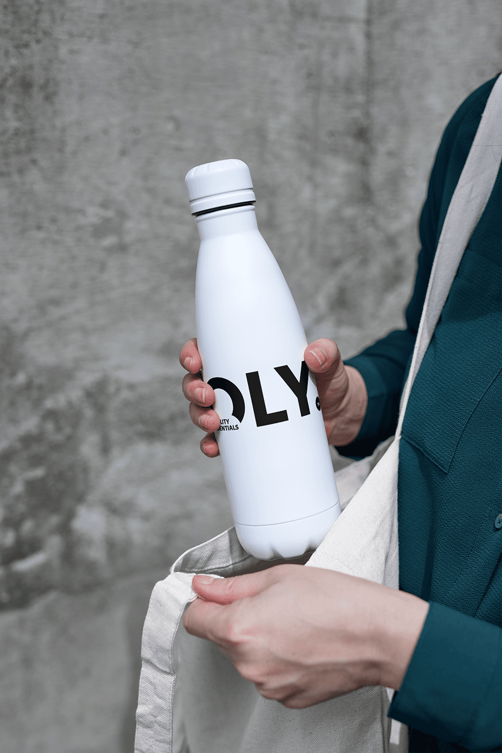 OLY-branded water bottle in use